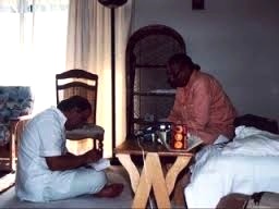 Sripad Yudhamanyu Prabhu seated at Srila Gurudevs lotus feet.